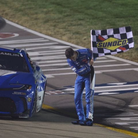Denny Hamlin pays tribute to the late Kyle Busch with a bow after he won Sunday's Cracker Barrel 400 at Nashville Superspeedway.